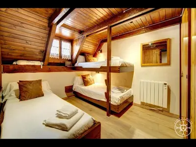 Cama o camas de una habitación en CASA MARMOTA de Alma de Nieve