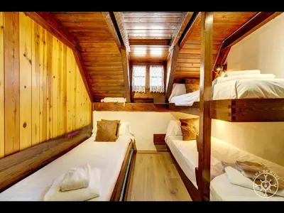 Cama o camas de una habitación en CASA MARMOTA de Alma de Nieve