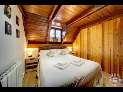 Cama o camas de una habitación en CASA MARMOTA de Alma de Nieve