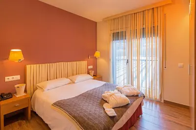 Cama o camas de una habitación en Aparthotel Trainera