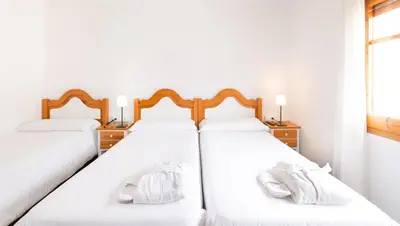 Cama o camas de una habitación en Hostal Trainera
