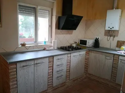 Una cocina o zona de cocina en Mas del Olivar