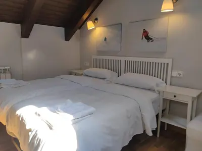 Cama o camas de una habitación en Casa Marmotte - tucasaenlospirineos