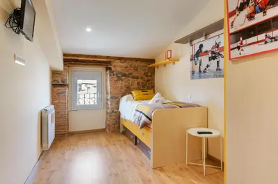 Cama o camas de una habitación en ALOJAMIENTO DUQUE DE JACA
