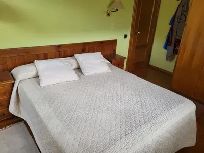 Cama o camas de una habitación en Casa de fusta al cor dels Pirineus