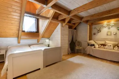 Cama o camas de una habitación en Fuente del Tesoro, dúplex vacacional en Panticosa