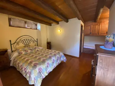 Cama o camas de una habitación en Fantàstica casa amb llar de foc