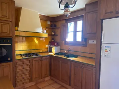 Una cocina o zona de cocina en Fantàstica casa amb llar de foc