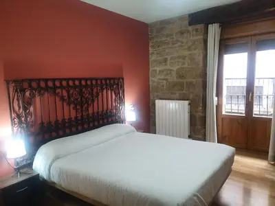Cama o camas de una habitación en Hostal Rural 18 de Abril