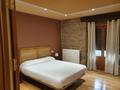 Cama o camas de una habitación en Hostal Rural 18 de Abril
