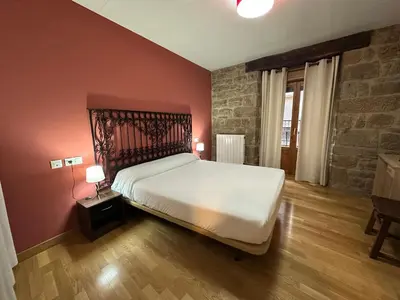 Cama o camas de una habitación en Hostal Rural 18 de Abril