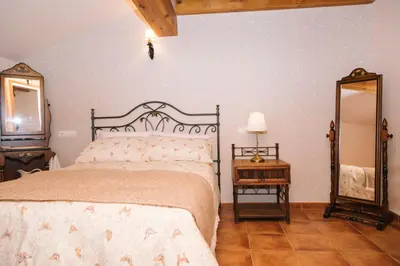 Cama o camas de una habitación en Casa rural el gato encantado