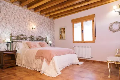 Cama o camas de una habitación en Casa rural el gato encantado