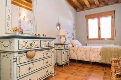 Cama o camas de una habitación en Casa rural el gato encantado