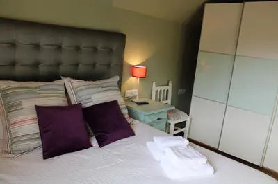 Cama o camas de una habitación en El Balcón del Garmo