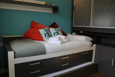 Cama o camas de una habitación en El Balcón del Garmo