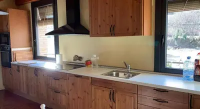 Una cocina o zona de cocina en El Molí de Cal Pastisser