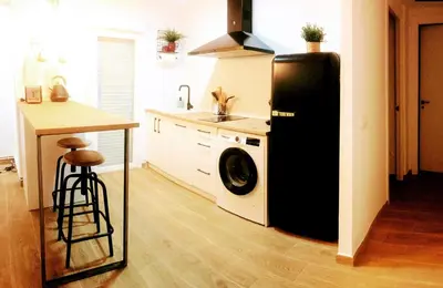 Una cocina o zona de cocina en Apartamentos La Casa del Maestro