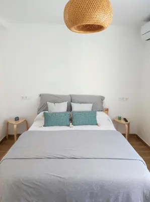 Cama o camas de una habitación en Apartamentos La Casa del Maestro