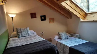 Cama o camas de una habitación en El Descanso del Sol - Apartamento en Pirineos