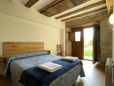 Cama o camas de una habitación en Palacio de Aralar Familias