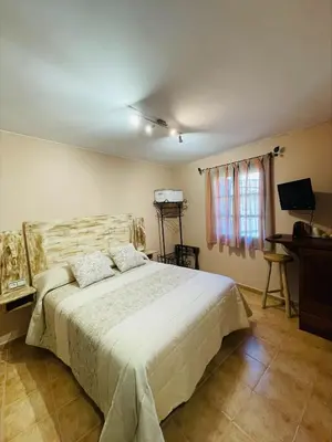 Cama o camas de una habitación en El Rincón de Andrea Habitaciones