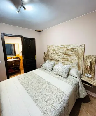 Cama o camas de una habitación en El Rincón de Andrea Habitaciones