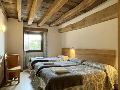 Cama o camas de una habitación en Palacio de Aralar Grande Familias