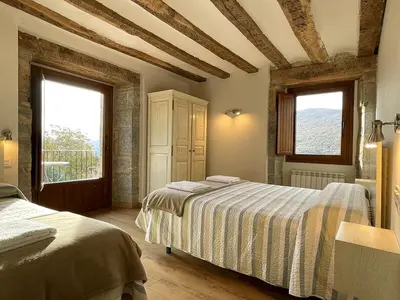 Cama o camas de una habitación en Palacio de Aralar Grande Familias