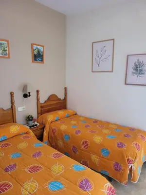 Cama o camas de una habitación en Allotjament rural Casa Milagros