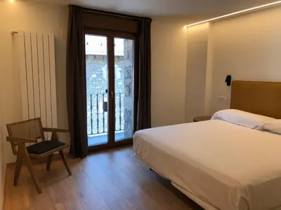 Cama o camas de una habitación en HOTEL MONTE PERDIDO