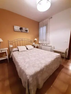 Cama o camas de una habitación en Casa Lola Beceite, terraza, barbacoa y chimenea