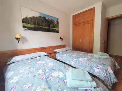Cama o camas de una habitación en CHECK-IN CASAS Siñoantonio