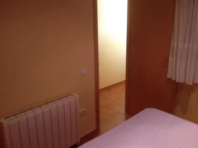 Cama o camas de una habitación en Apartaments la Fabrica