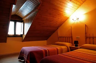 Cama o camas de una habitación en Casa Rural la Comella