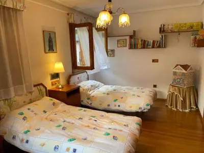 Cama o camas de una habitación en Casa Conchita de Benasque