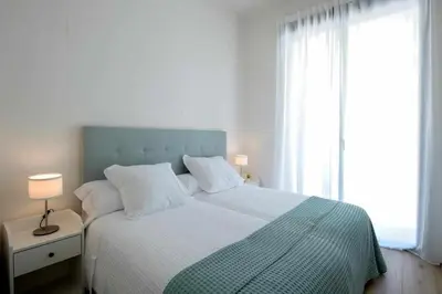 Cama o camas de una habitación en Mike House: Alójate en el corazón de Zaragoza