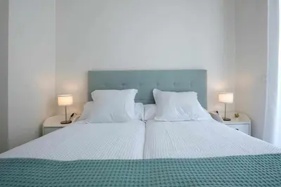 Cama o camas de una habitación en Mike House: Alójate en el corazón de Zaragoza