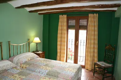 Cama o camas de una habitación en La Casa del Azafrán