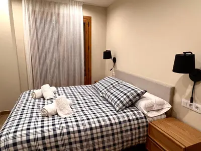 Cama o camas de una habitación en Apartaments Areny - L'Amfitriona