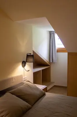Cama o camas de una habitación en Apartaments Areny - L'Amfitriona