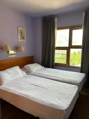 Cama o camas de una habitación en Apartamentos SNÖ Cerler