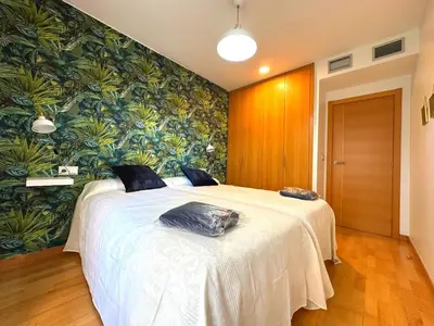 Cama o camas de una habitación en Dos Torres Las Comarcas - Amplia Terraza y Estacionamiento Gratuito