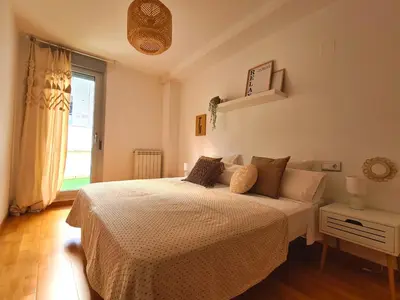 Cama o camas de una habitación en Dos Torres Las Comarcas - Amplia Terraza y Estacionamiento Gratuito