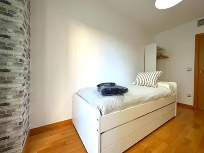 Cama o camas de una habitación en Dos Torres Las Comarcas - Amplia Terraza y Estacionamiento Gratuito