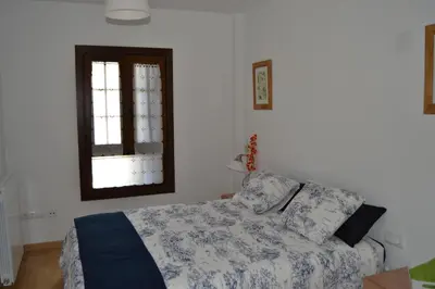 Cama o camas de una habitación en Apartamentos Portal de Ordesa