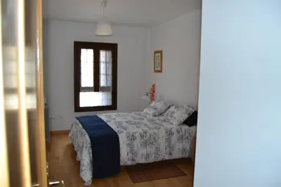 Cama o camas de una habitación en Apartamentos Portal de Ordesa