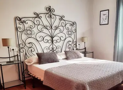 Cama o camas de una habitación en Mirador del Teatro Romano
