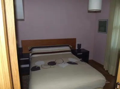 Cama o camas de una habitación en APARTAMENTO ARCE I en el Valle de Benasque