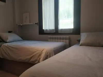 Cama o camas de una habitación en CHECK-IN CASAS La Tuca